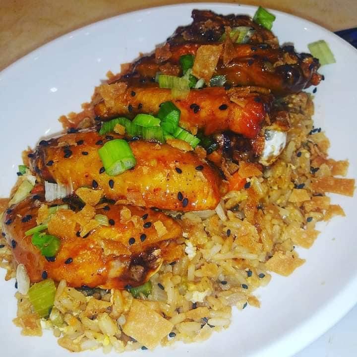 Glazed wings over seasoned fried rice